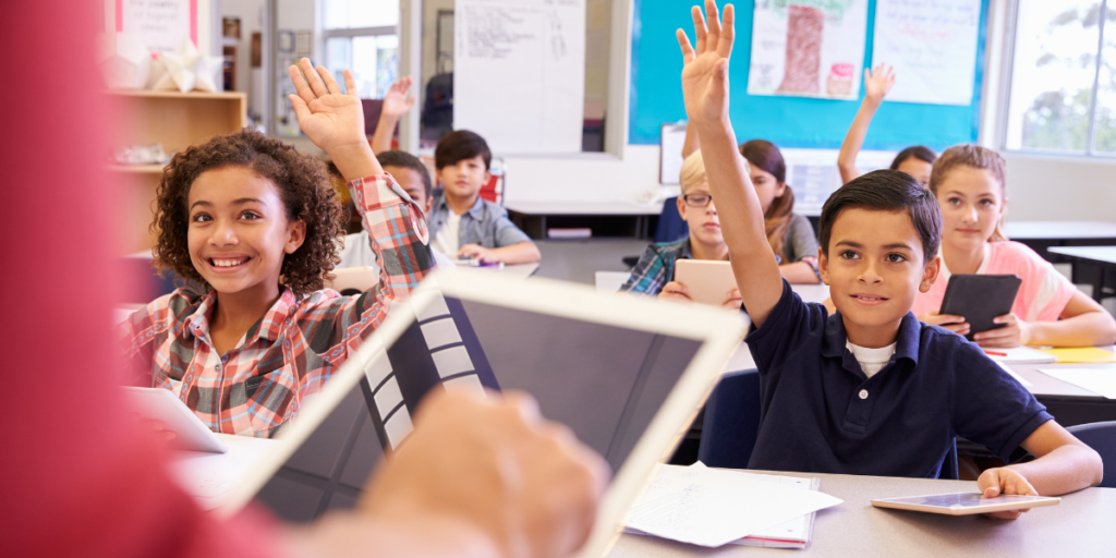 Teacher taking attendance with software